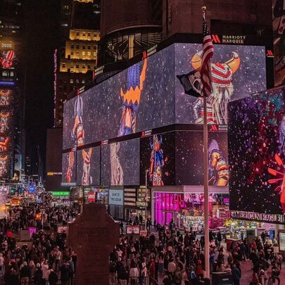 Times Square NYC activation with light panels and crowds.