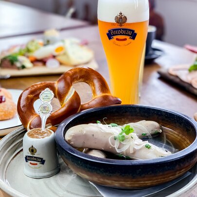 German food including sausages, cherry cakes and beer.