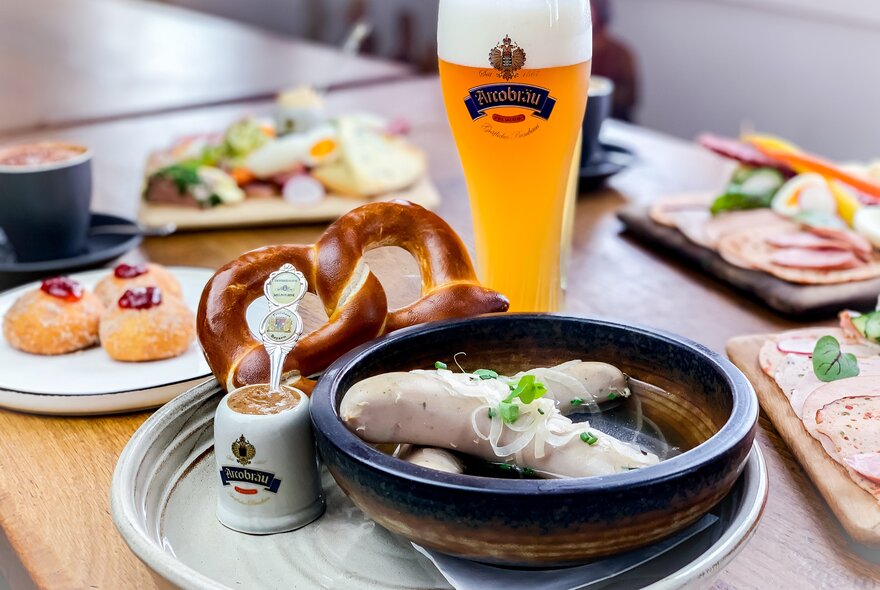 German food including sausages, cherry cakes and beer.