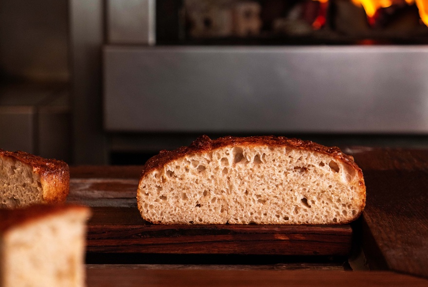 A cross section view of a rustic loaf of bread