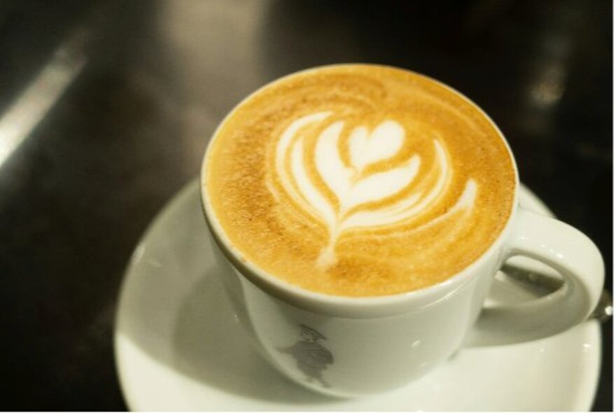 Cup of coffee with classic froth design.