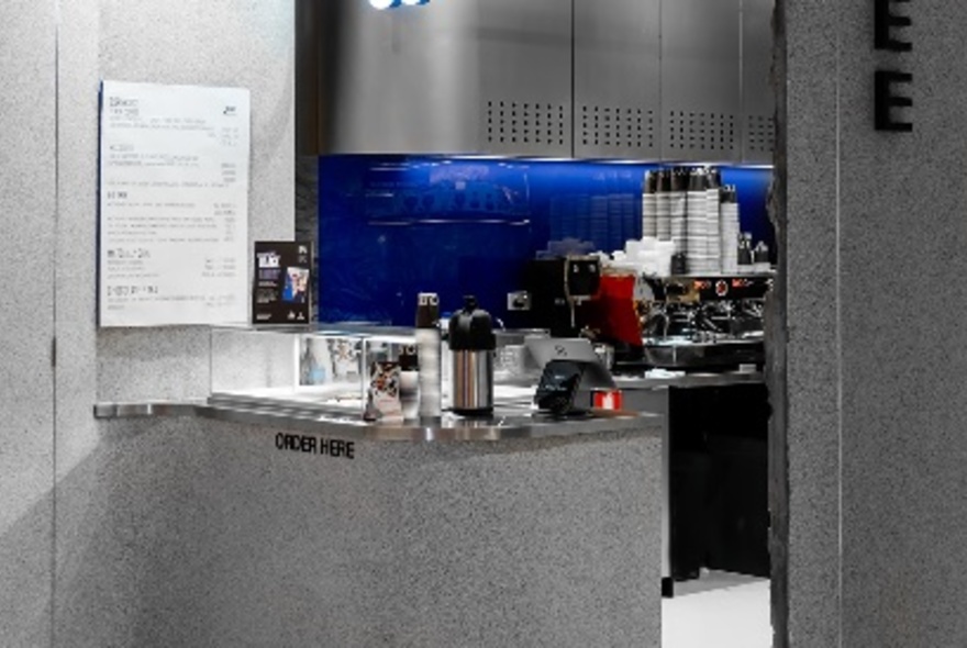 The interior of an industrial looking coffee shop. 