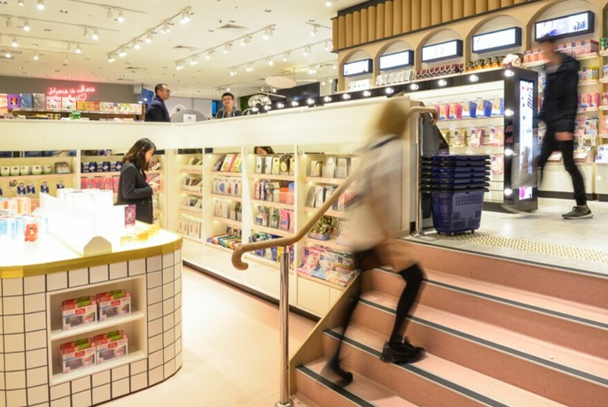 Blurred motion image of shoppers in Merry Seasons. 