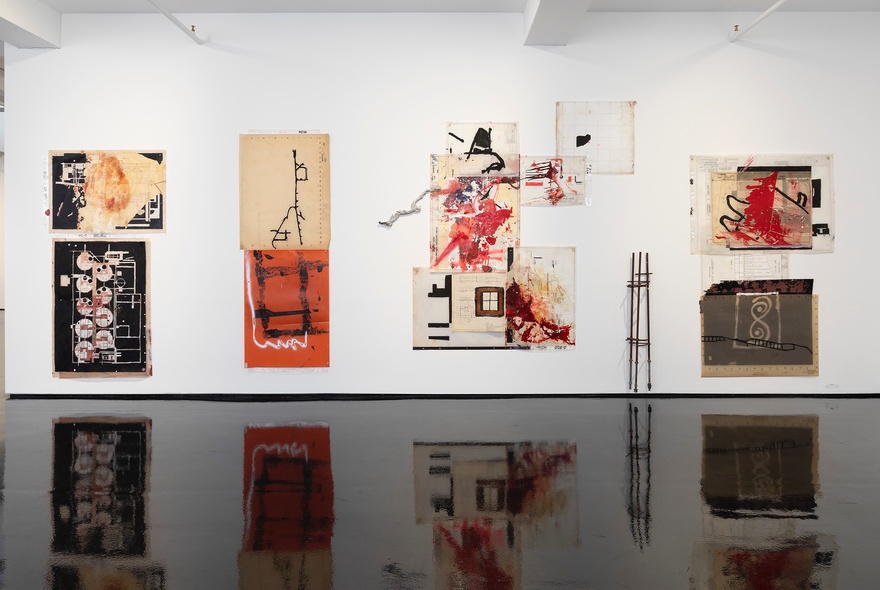 Installation view of an exhibition of  artworks by the Australian artist collective Tennant Creek Brio, known for repurposing found objects into art. 