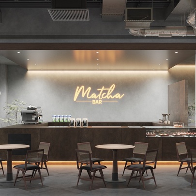 Interior of a stylish restaurant, with a central sleek bar, and small round tables and chairs in front of this space, and the words 'Matcha Bar' written on the back wall.