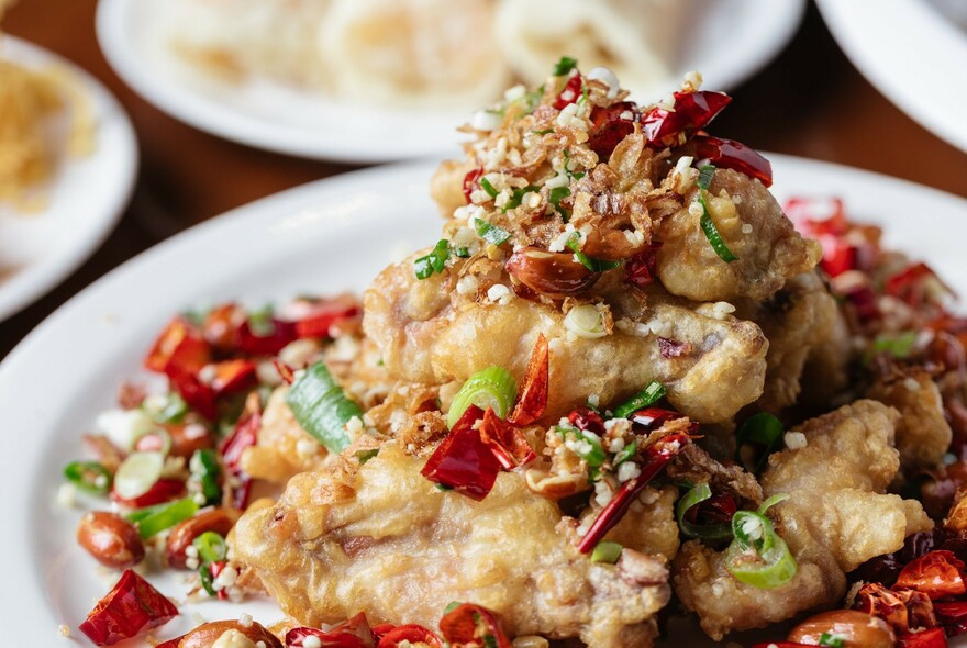 Close up of a fried dish laden with chilli.