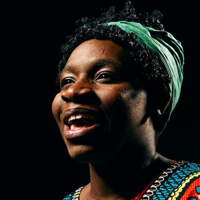 A close up of a woman on stage playing reknowned jazz singer and civil rights activist, Nina Simone.