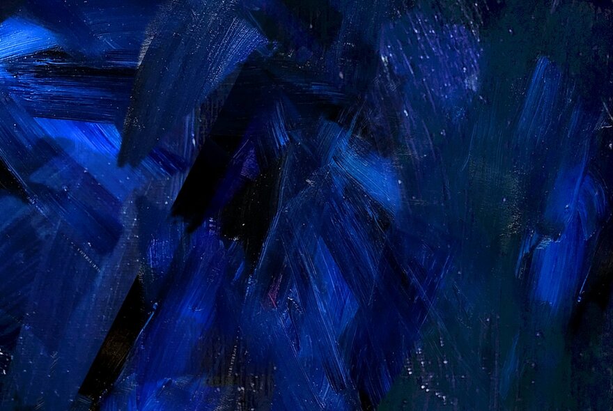 A blue-black image of shards of glass.