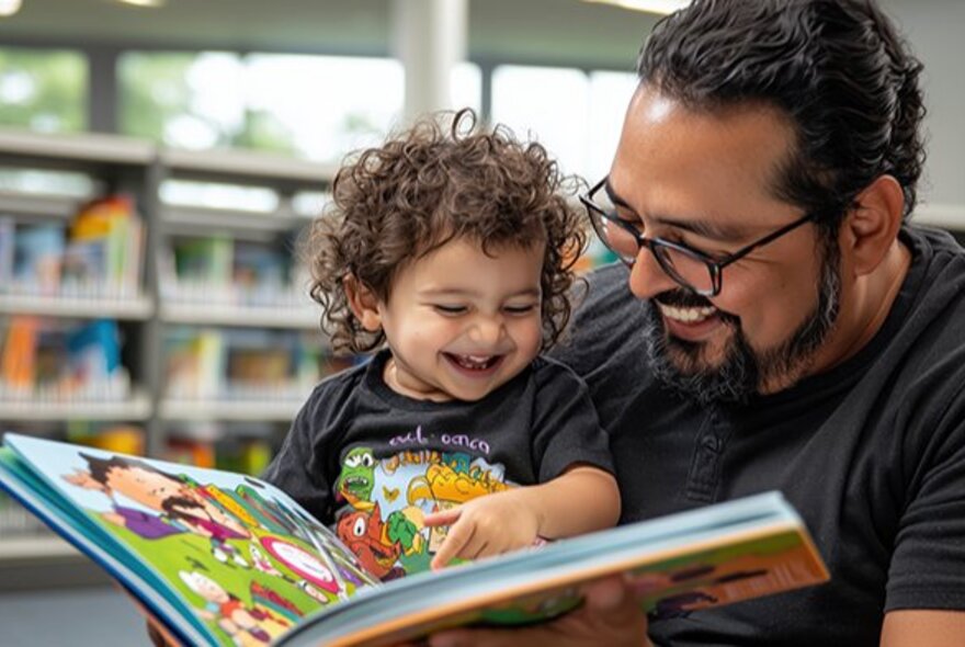 A man reading a colourful picture book to a young child with curly hair at a Melbourne library.