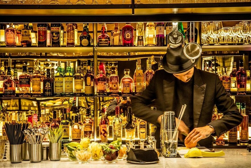 A bartender making a cocktail at Arlechin.