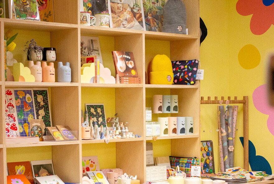 Yellow shelving and walls in a shop that sells cute knickknacks. 