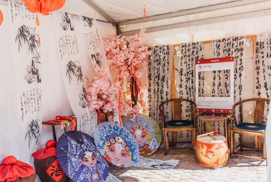 A stall at a market showing Chinese themed handicrafts.