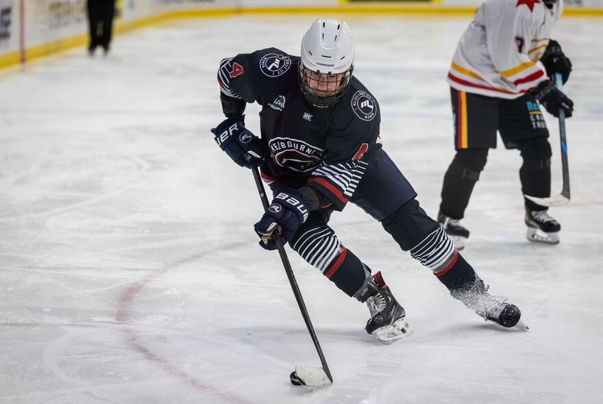 Ice hockey players on the ice during a game.