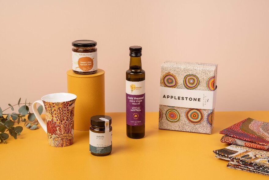 Museum shop items for sale including condiments, mug and teatowels.