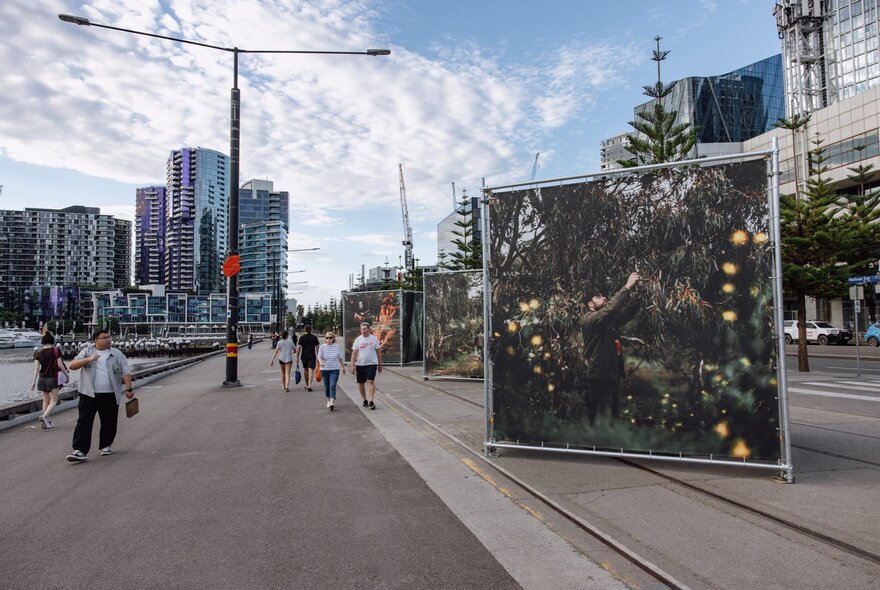 Large scale artworks depicting smoking ceremonies, outdoors at Melbourne's Docklands. 