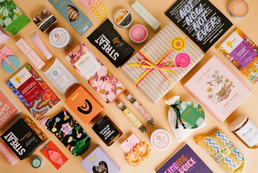 Goods for sale arranged on a table inside the Queen Victoria Women's Centre SHOP!