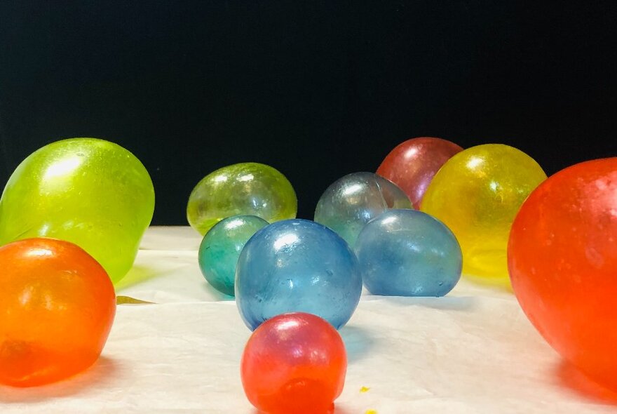 Artwork installation of balloons in colours of blue, orange and green.