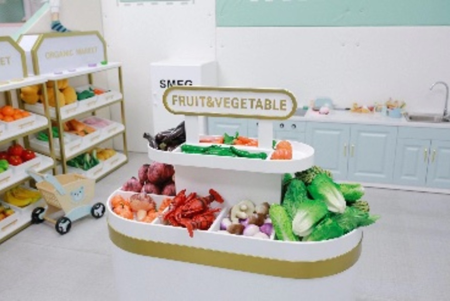 Interior of a cafe with a play supermarket for kids. 