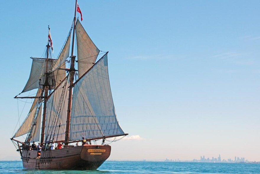 The 27-metre topsail schooner Enterprize a replica of a tall ship dating from 1830, sailing on water.