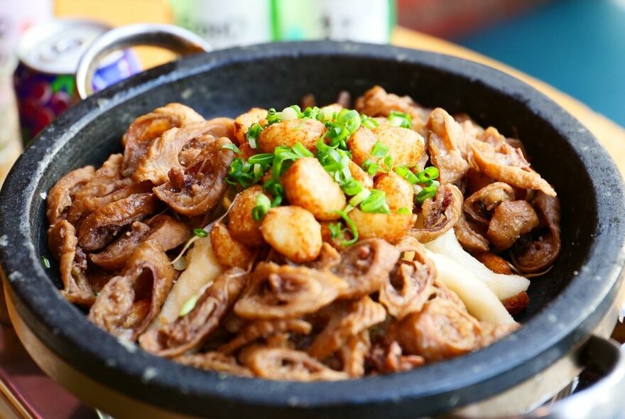 A shallow bowl of food on a table.