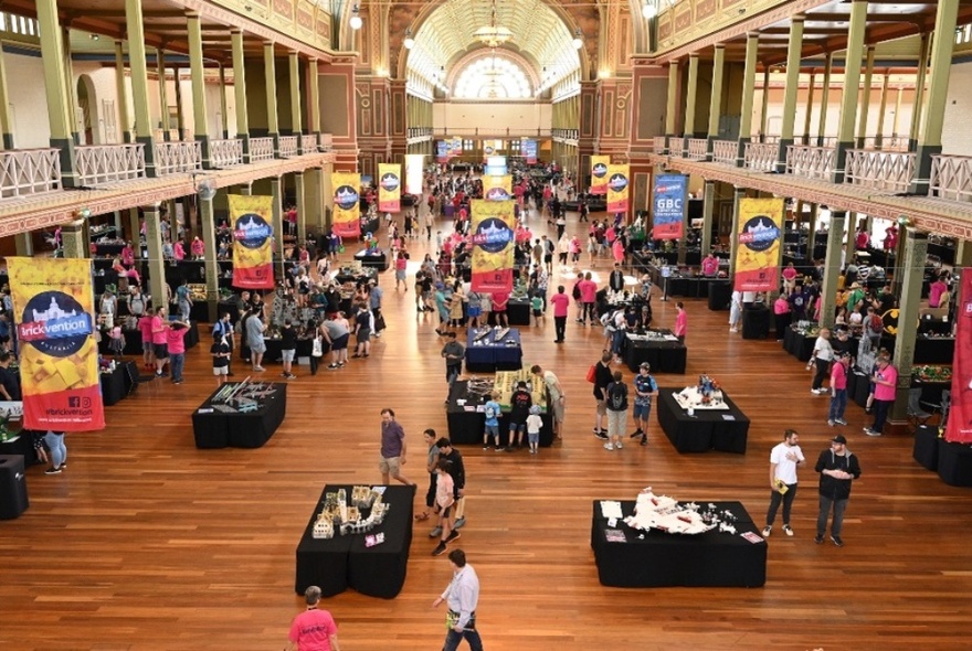 Exhibition Building main hall with displays and posters.