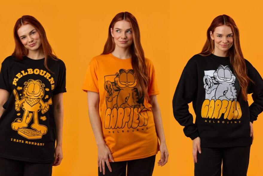 Models wearing Garfield-branded black and orange T-shirts