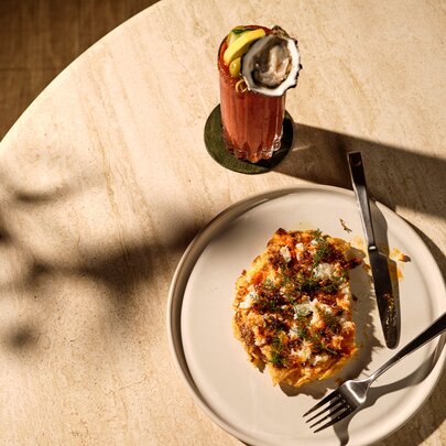 A brunch dish and bloody mary cocktail. 