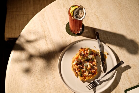 A brunch dish and bloody mary cocktail. 