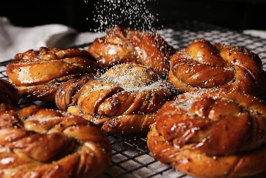 Pastries sprinkled with icing sugar.