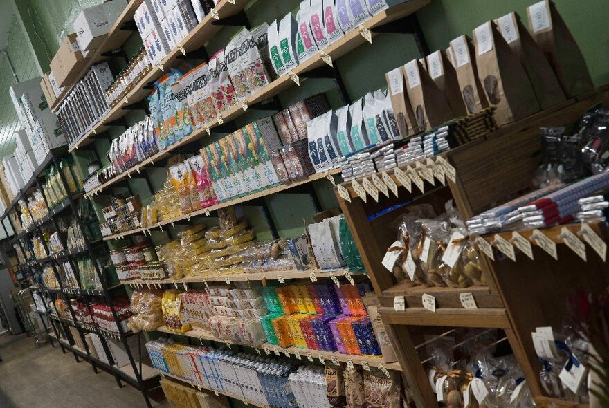 Shelves of grocery produce in a store. 