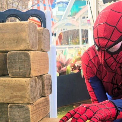 Spiderman next to a woodblock puzzle.