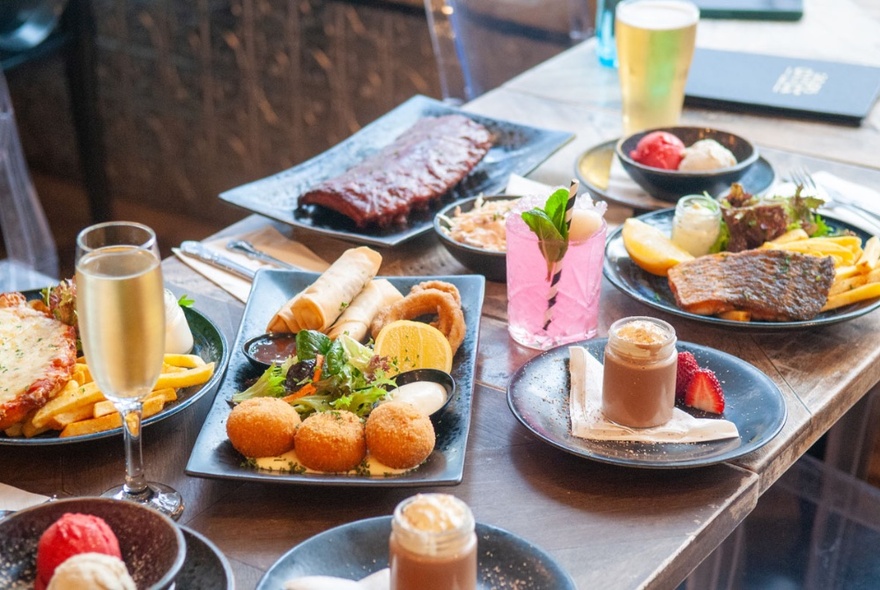 A selection of food and drinks on a table. 