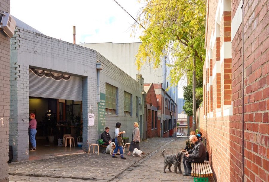 A cafe behind a roller door in a laneway