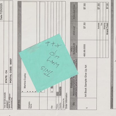 Paper invoice with green post-it note.