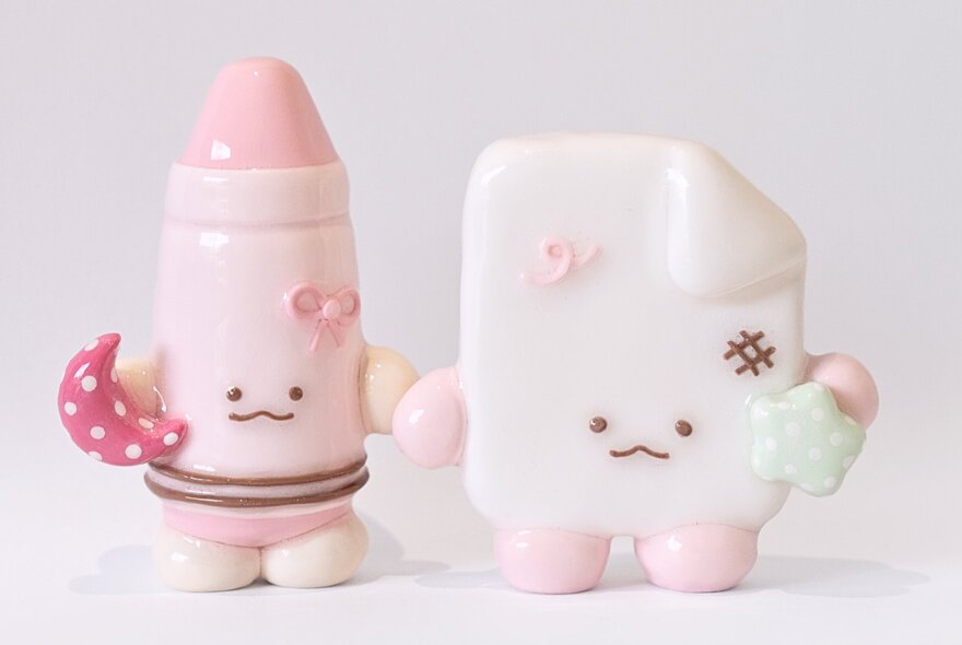 Two pastel-coloured cute clay trinkets.