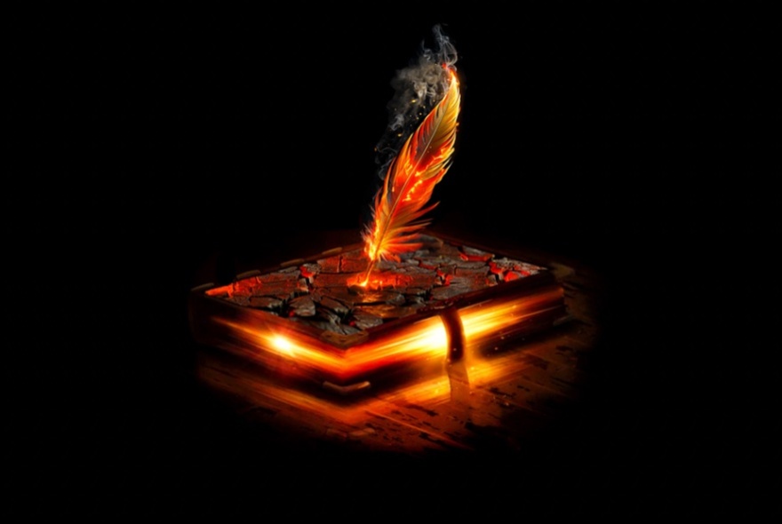 Image of a feather stuck in a book that is glowing, as if filled with embers. 