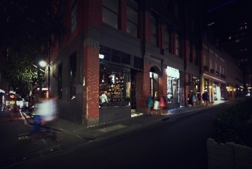 Street view of Bijou Bottle Store at night.