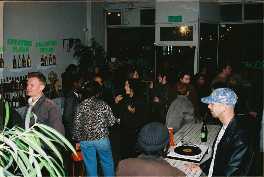 A crowd of people dancing in a room.