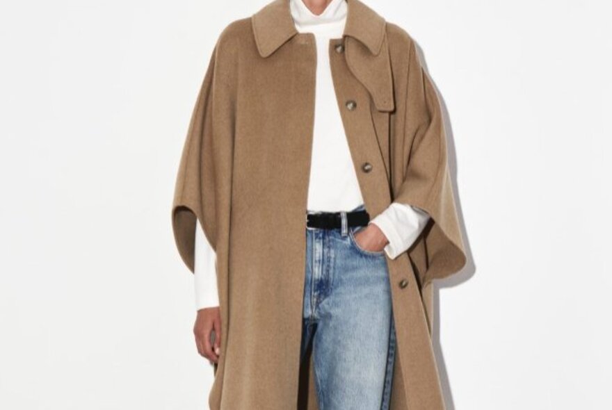 a beige cape coat