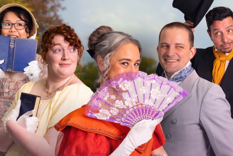 A cast of impro actors in Regency clothing, the woman in front with a purple fan.