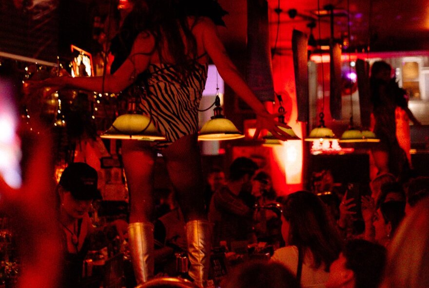 People seated in a red-it bar.