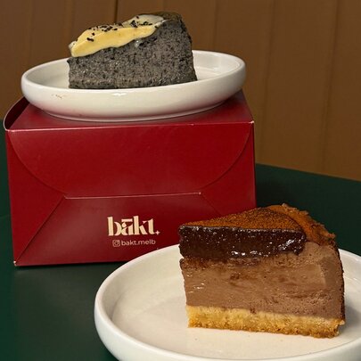Two slices of cake on a box.