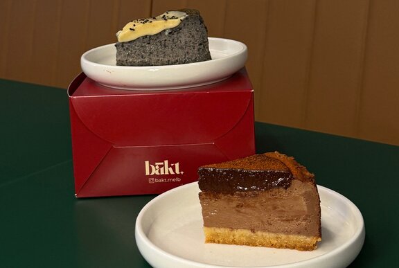 Two slices of cake on a box.