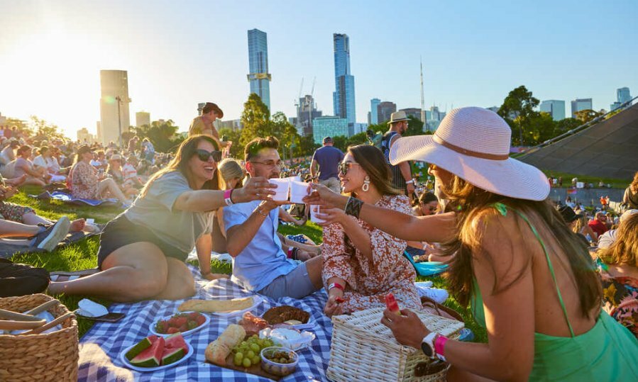 A group of friends having a picnic at an outdoor event