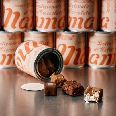 Gelato filled chocolates spilling out of a tin.