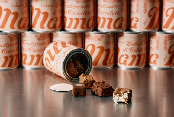 Gelato filled chocolates spilling out of a tin.