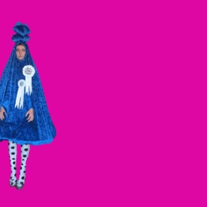 Drawing of a figure wearing a blue cape with white rosettes on a pink background.