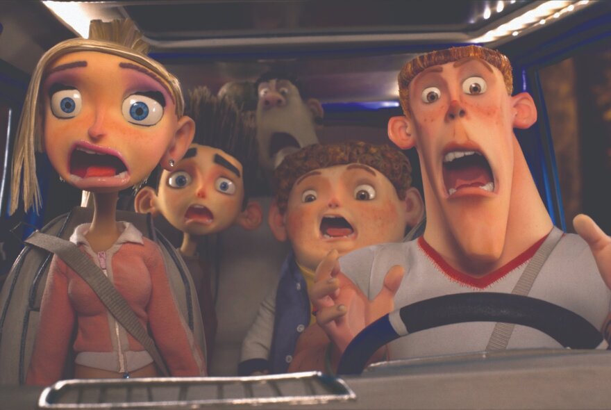 A still shot from the animated film ParaNorman, with four  characters looking terrified inside a vehicle.