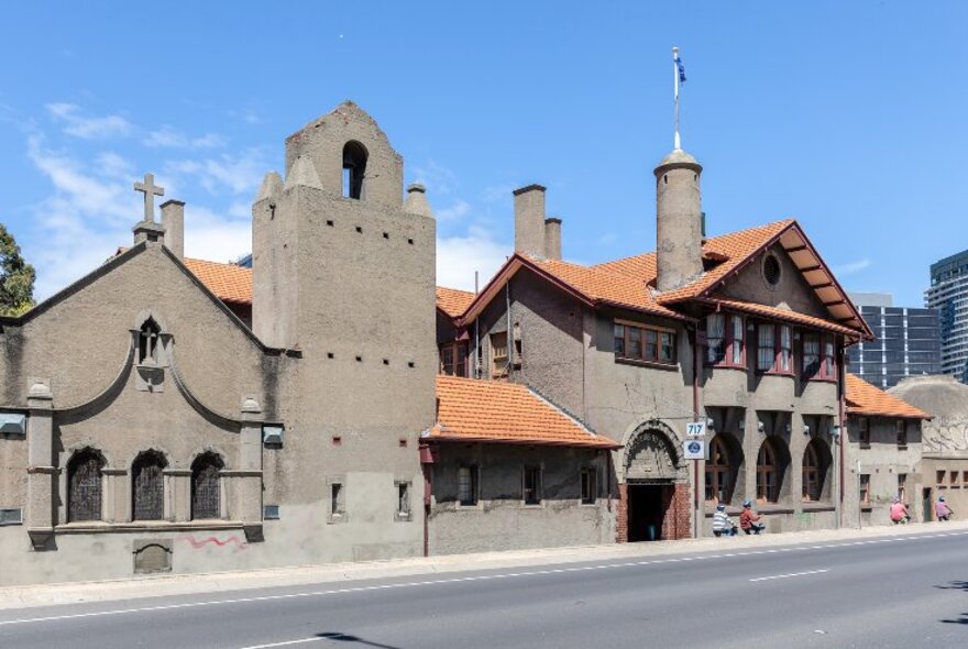 Mission to Seafarers building with Arts and Crafts architecture, terracotta roofs and domed annex.