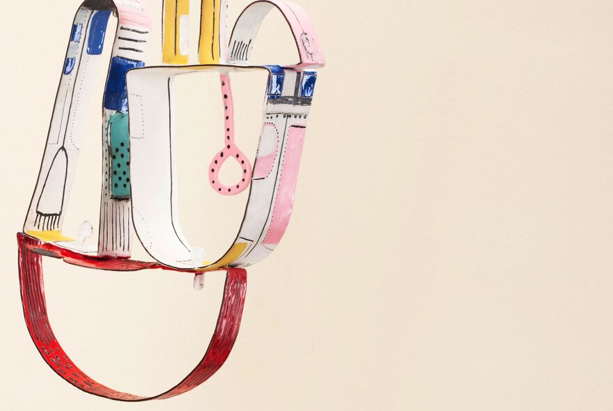 A colourful illustration of curved shapes on paper.